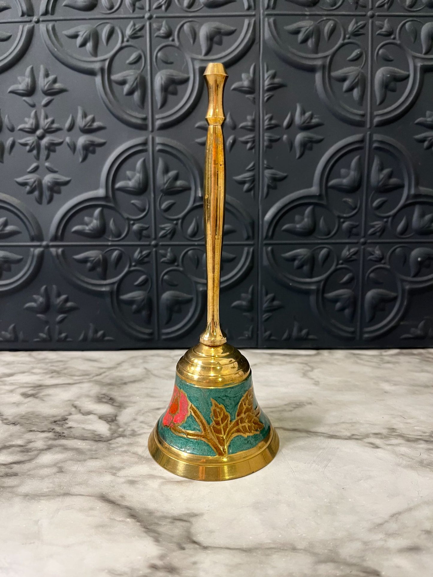 Cloisonné brass bell with pink flower