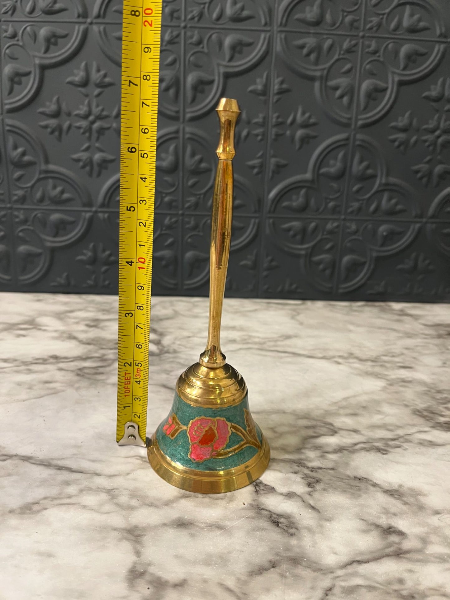 Cloisonné brass bell with pink flower